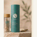 Nudora Green probiotic — glass vial with bamboo cap and teal tube