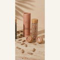 Nudora Women's Hair Support — blush tube and frosted vial with bamboo cap