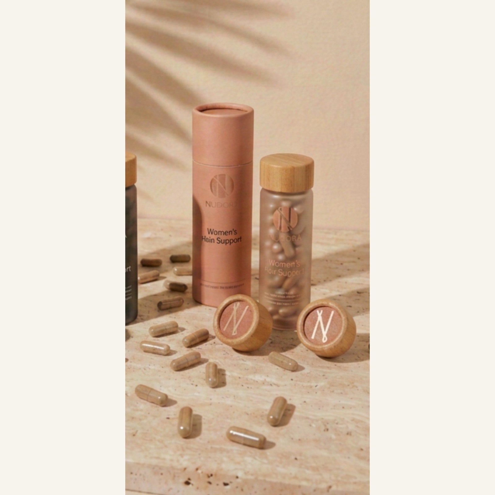 Nudora Women's Hair Support — blush tube and frosted vial with bamboo cap